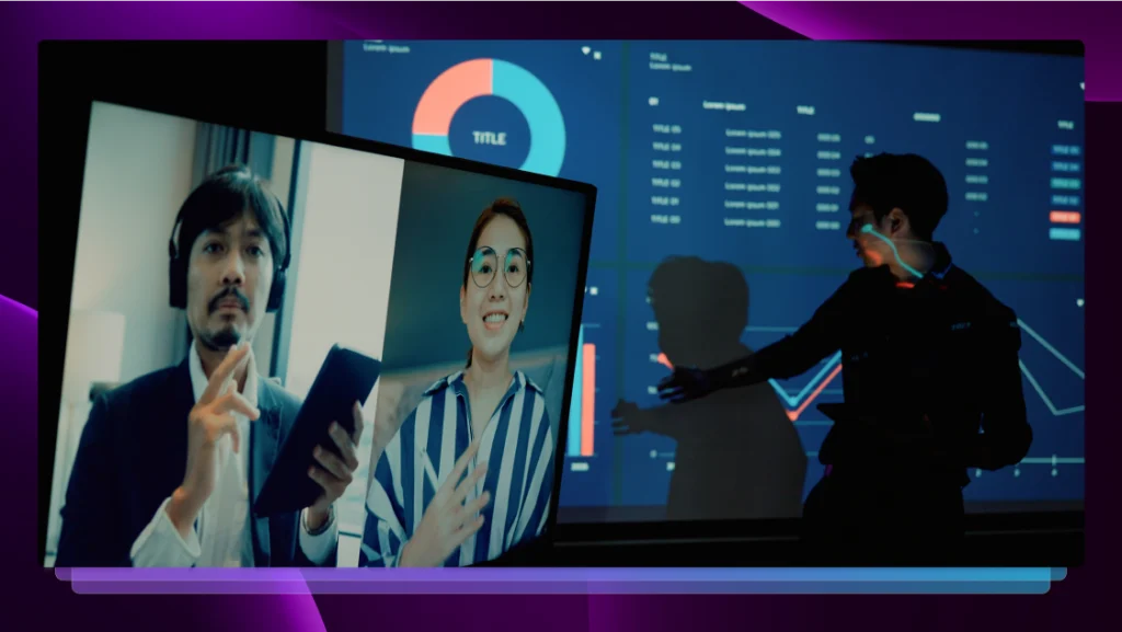 Two people on a video call interact with a third person who is standing in the room with the television, pointing at a graph.