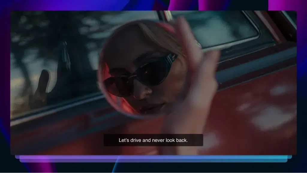 A woman is holding a hand mirror. You can see her face with sunglasses on in the reflection. A red car is behind the hand holding the mirror. A subtitle reads: Let’s drive and never look back.