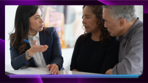 A professionally dressed woman discussing an important matter with an older couple, who both look at her intently.